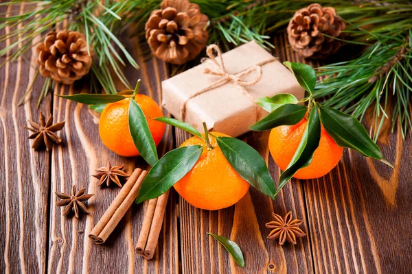 Holiday tangerines with fir branches and cones Stock Picture