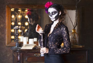 Beautiful woman painted as skeleton. Halloween theme clipart