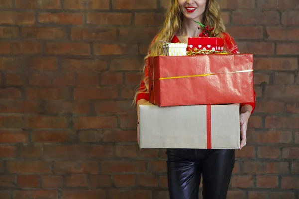 Christmas gifts and young woman — Stock Photo, Image