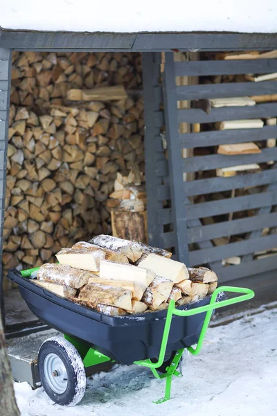 Firewood stacked in winter — Stock Photo, Image