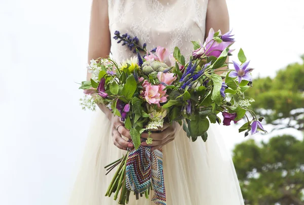 Beautiful bride outdoors in a forest. — Stock Photo, Image