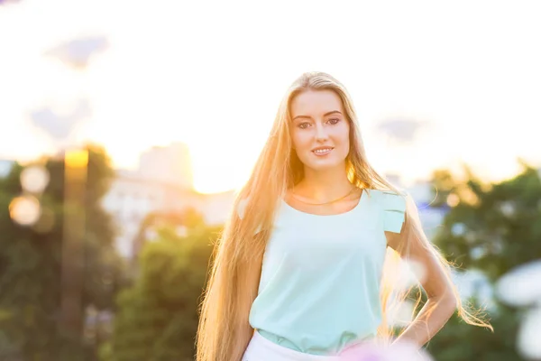 Outdoors portrait of beautiful young blond woman — Stock Photo, Image