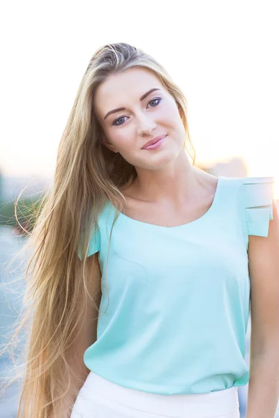 Outdoors portrait of beautiful young blond woman — Stock Photo, Image