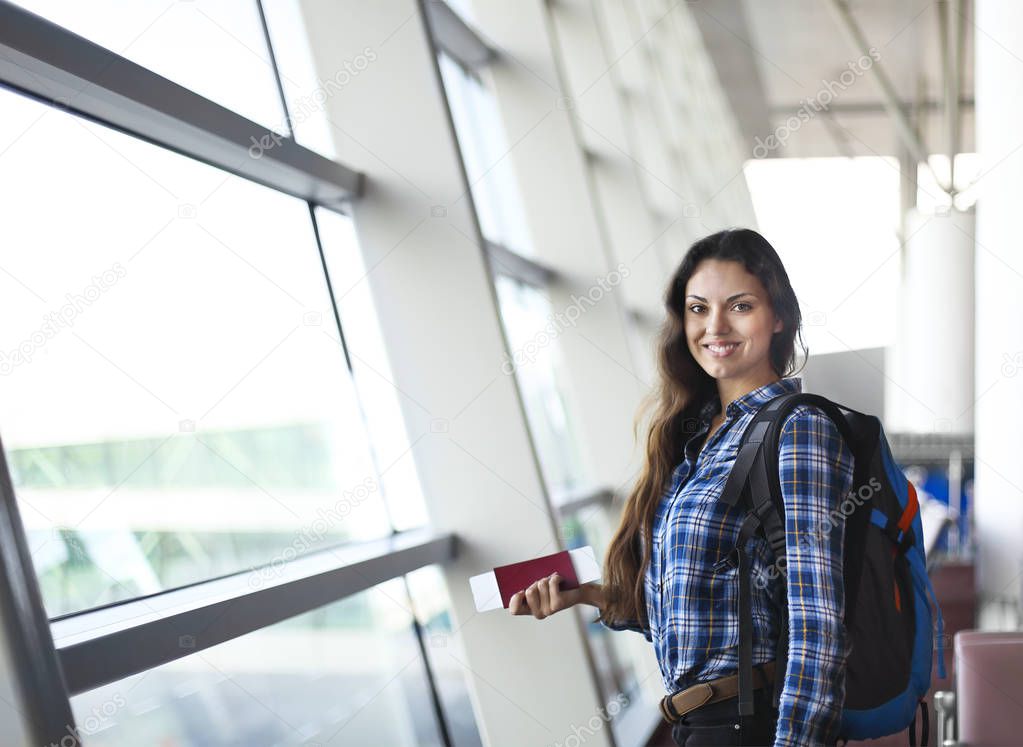 Pretty young female passenger at the airport 