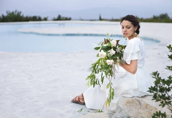 Portrait young bride with brunette hair in white wedding dress a — Stock Photo, Image