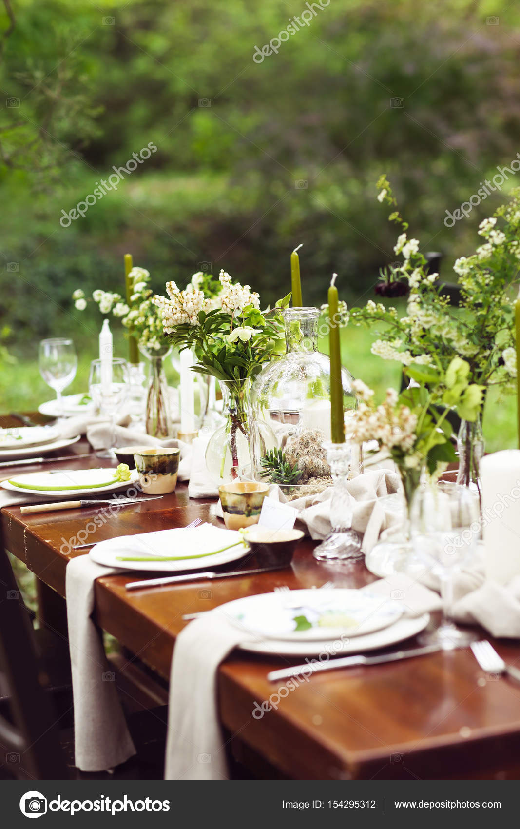 Decoration Of Wedding Table With Crystal Vases Flowers And Bran