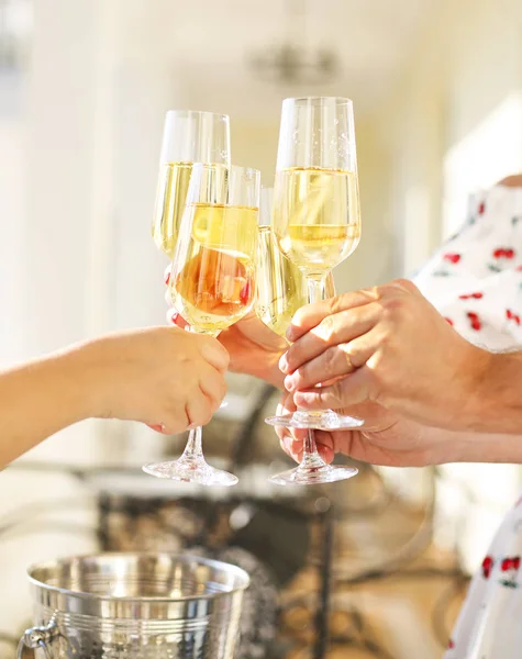 People holding glasses of champagne making a toast — Stock Photo, Image