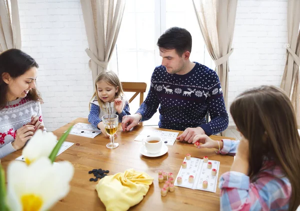 Happy young family plaing board game — Stock Photo, Image