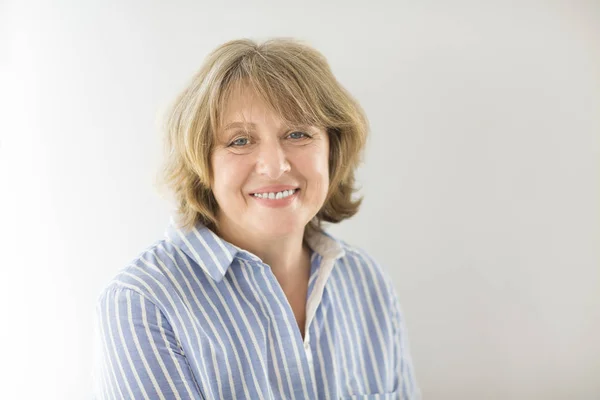 Portrait of middle age woman in the room — Stock Photo, Image