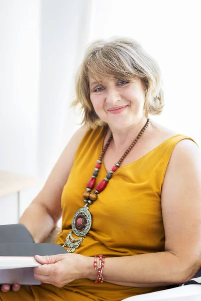 Portrait of middle age woman in the room — Stock Photo, Image