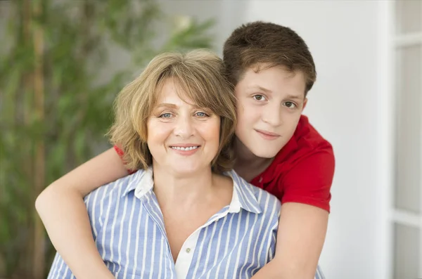 Mid-age woman with teen boy — Stock Photo, Image
