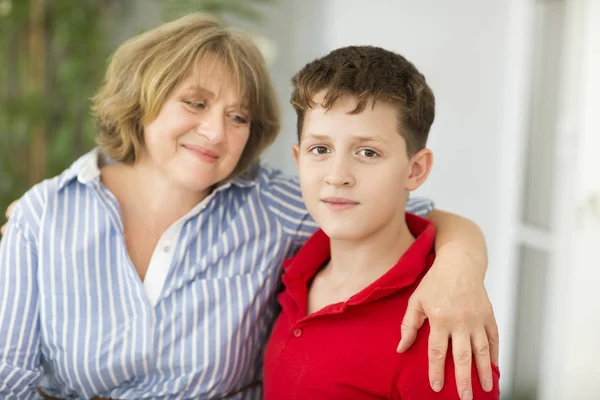 Mid-age woman with teen boy — Stock Photo, Image