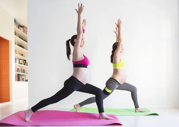 Two young pregnant women doing fitness exercises — Stock Photo, Image