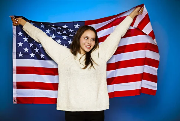 Young girl wrapped in american flag — Stock Photo, Image