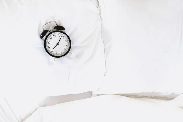 Alarm clock in bed. Overslept or bed time concept — 스톡 사진