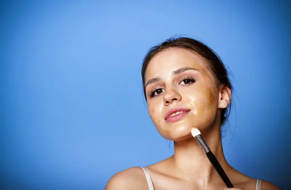 Optimistic Young Female Smiling Looking Camera While Applying Golden Lifting — Stock Photo, Image