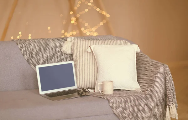 Laptop Empty Blue Screen Eyeglasses Placed Grey Sofa Light Pillows — Stock Photo, Image