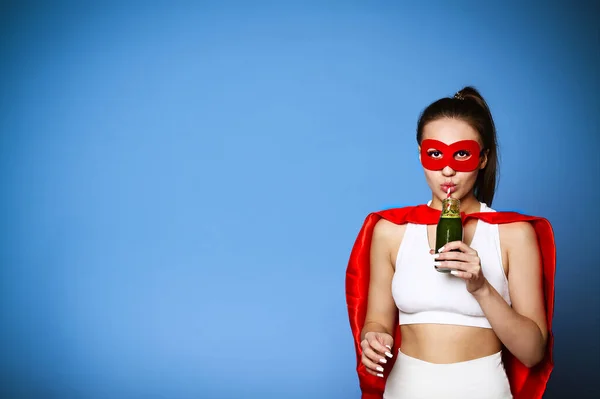 Young Female Superhero Clenched Fist Enjoying Vitamin Drink Looking Camera — Stock Photo, Image