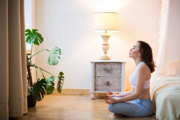 Young Brown Haired Woman Pajamas Practicing Yoga Bright Bedroom Mornin — Stock Photo, Image