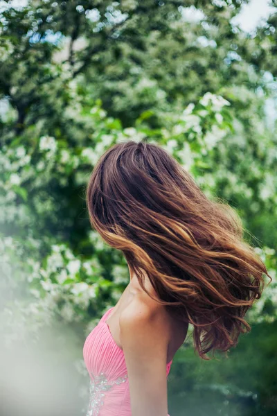 Young female with beautiful long hair in motion — Stock Photo, Image