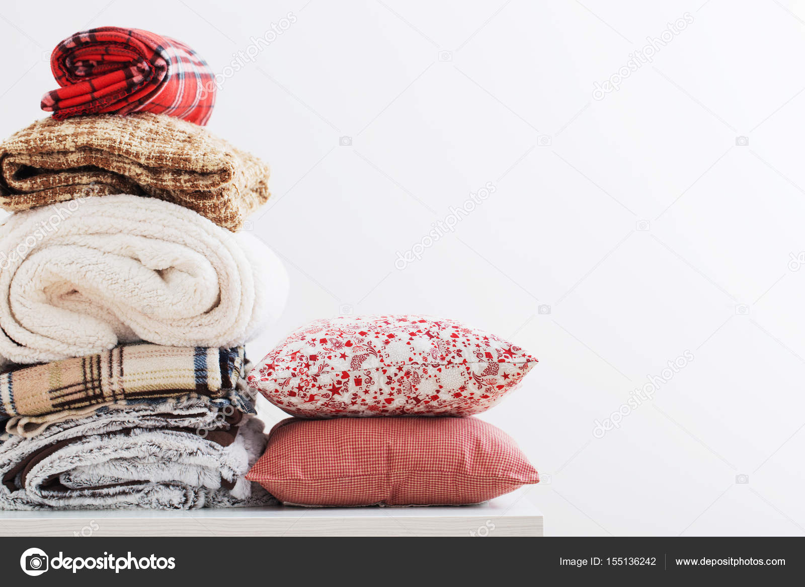 Pile of blankets on a white background Stock Photo by ©Kruchenkova