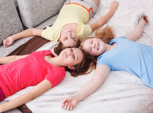 three happy girls at home