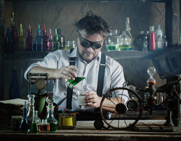 crazy medieval scientist working in his laboratory