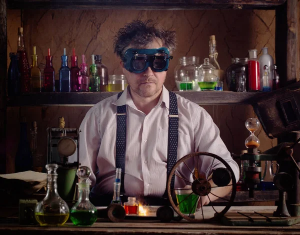 Crazy medieval scientist working in his laboratory — Stock Photo, Image