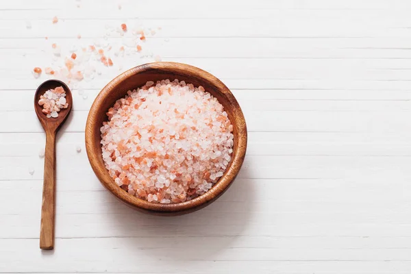 Himalayan salt on white wooden background — Stock Photo, Image