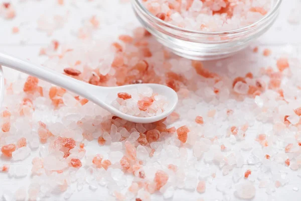 Himalayan salt on white wooden background — Stock Photo, Image