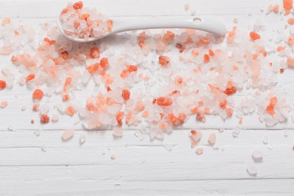 Himalayan salt on white wooden background — Stock Photo, Image