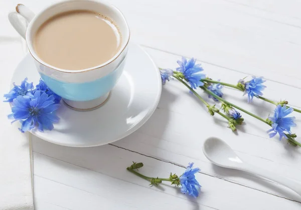 Drink from chicory in a cup on the white wooden table — Stock Photo, Image