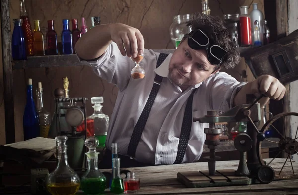 Crazy medieval scientist working in his laboratory — Stock Photo, Image