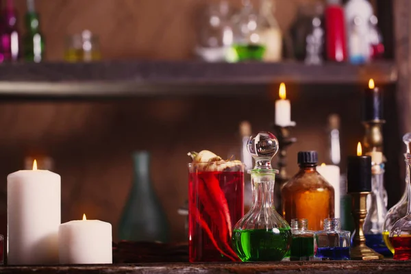 Magic potion, ancient books and candles — Stock Photo, Image