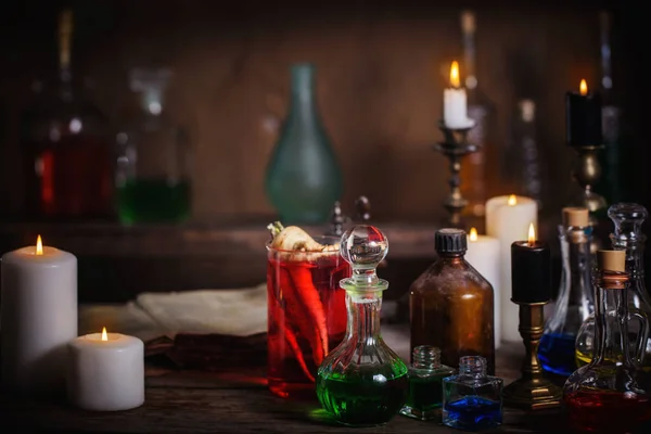 Magic potion, ancient books and candles — Stock Photo, Image