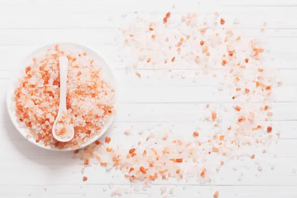 Himalayan salt on white wooden background — Stock Photo, Image