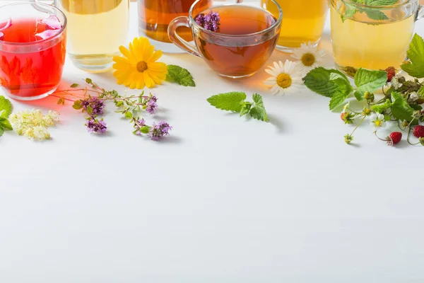 Herbal tea in cups on a white background — Stock Photo, Image