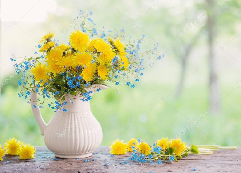 bouquet with forget-me-not and dandelions