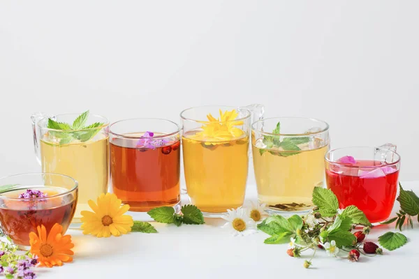 Herbal tea in cups on a white background — Stock Photo, Image