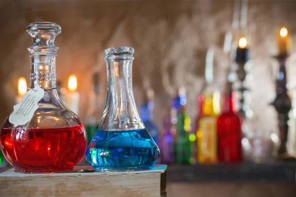 Magic potion, ancient books and candles — Stock Photo, Image