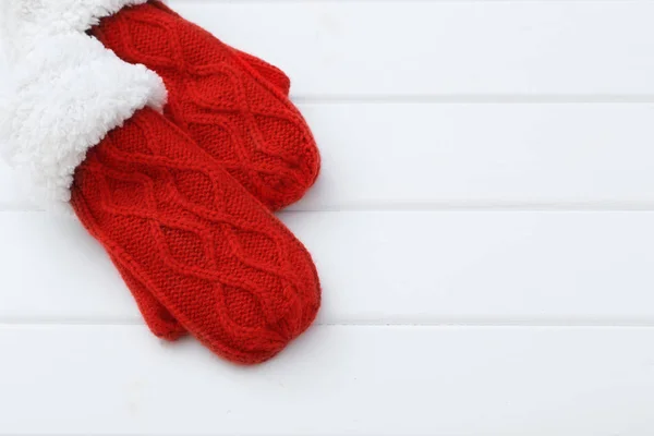 Red mittens on wooden background — Stock Photo, Image