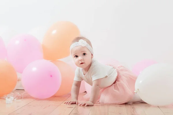 Beautiful little girl with balloons — Stock Photo, Image
