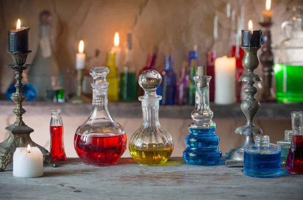 Magic potion, ancient books and candles — Stock Photo, Image