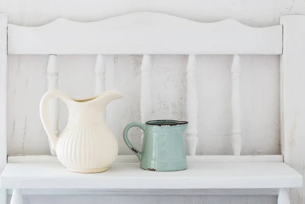 Dinnerware on white wooden shelf — Stock Photo, Image