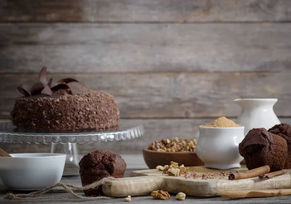 Chocolate cake on old wooden table — Stock Photo, Image