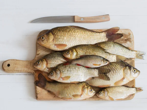 River raw fish on wooden table — Stock Image River raw fish on wooden table Stock Image