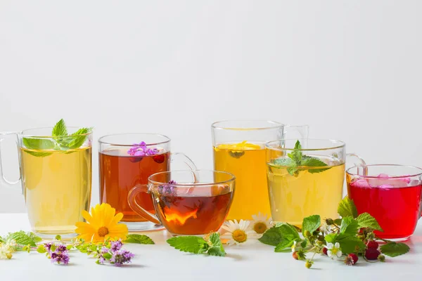 Herbal tea in cups on a white background — Stock Photo, Image