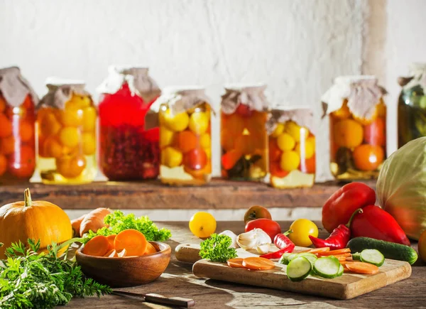 Canned and fresh vegetables in jars — Stock Photo, Image