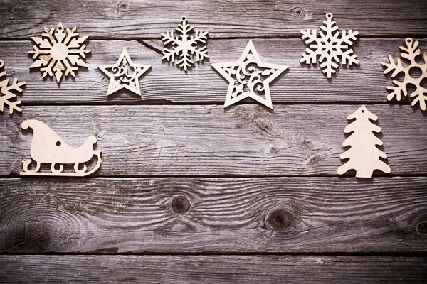 Wooden snowflakes and srars on old dark background — Stock Photo, Image
