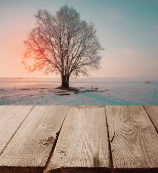 Beautiful winter landscape with old wooden table — Stock Photo, Image